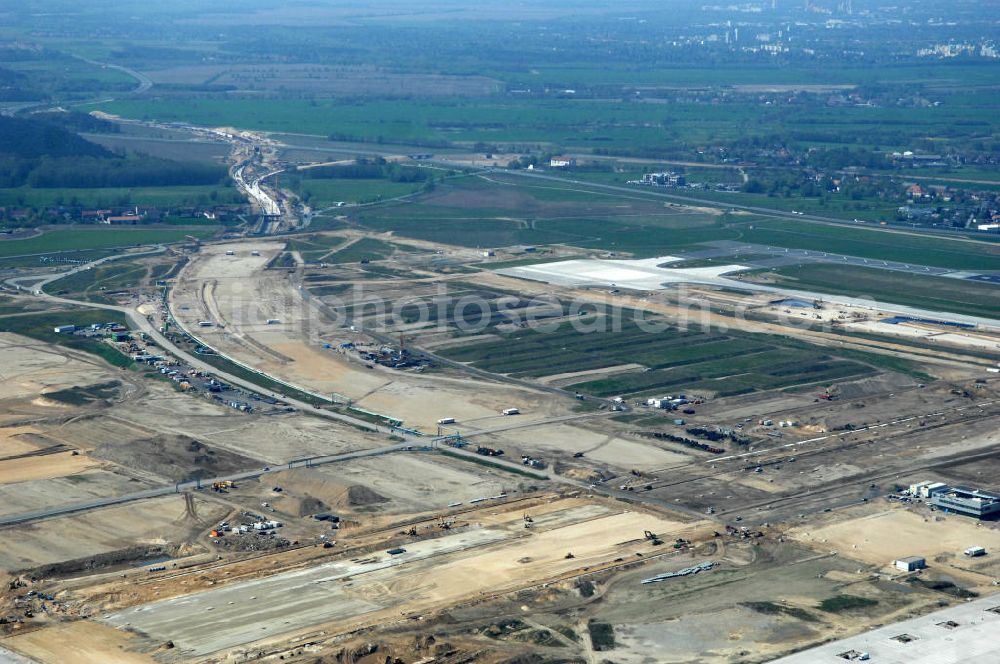 Aerial image Schönefeld - Blick auf die Baustellen am Flughafen Berlin-Schönefeld BBI (SXF). Ausführende Firmen: Hochtief AG; EUROVIA Beton; PORR; BERGER Bau; Karl Weiss; Matthai; Schäler Bau Berlin GmbH; STRABAG; MAX BÖGL. Baustellen am Flughafen Berlin-Schönefeld BBI - Construction fields at Berlin-Schoenefeld Airport BBI.