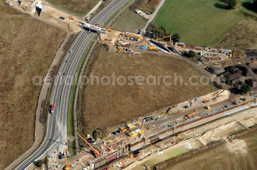 Aerial photograph Selchow - Blick auf die Baustellen der Gleistrassen und Tunnelzuführungen zum neuen Fern- und S-Bahnhofes der Deutschen Bahn an der Selchower Kurve am Gelände der Großbaustelle Neubau Bahnhof BBI (SXF) am Flughafen Berlin - Schönefeld. Ausführende Firmen: Hochtief AG; EUROVIA Beton; PORR; BERGER Bau; Kark Weiss; Matthai; Schäler Bau Berlin GmbH; STRABAG; MAX BÖGL