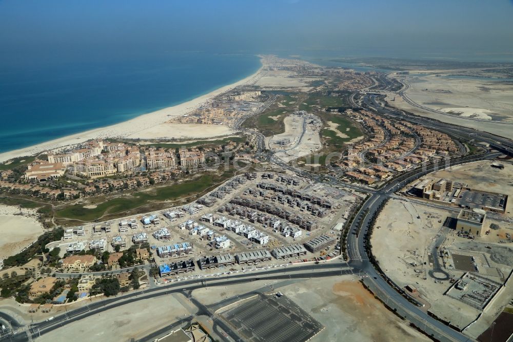 Aerial photograph Abu Dhabi - Construction sites for new residential areas and hotels at the coast of Persian Gulf on Saadiyat Island in Abu Dhabi in United Arab Emirates