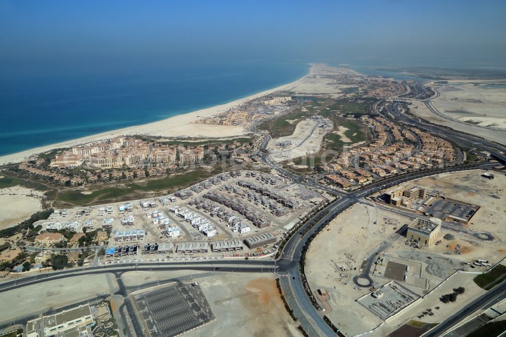 Abu Dhabi from above - Construction sites for new residential areas and hotels at the coast of Persian Gulf on Saadiyat Island in Abu Dhabi in United Arab Emirates