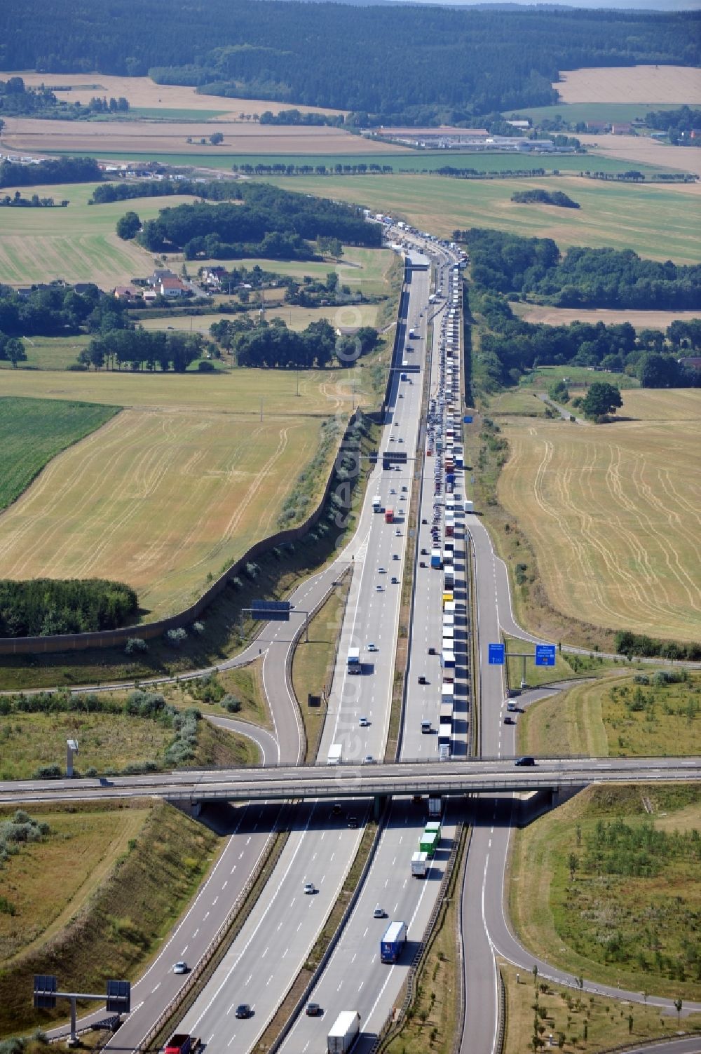 Triptis from above - Buildings and route of the motorway A9 motorway with four lanes now. Currently, reconstruction, expansion and new construction work is underway for the six-lane expansion of Highway 9 between Triptis and Schleiz by Wayss & Freytag Ingenieurbau and EUROVIA VINCI in Thuringia