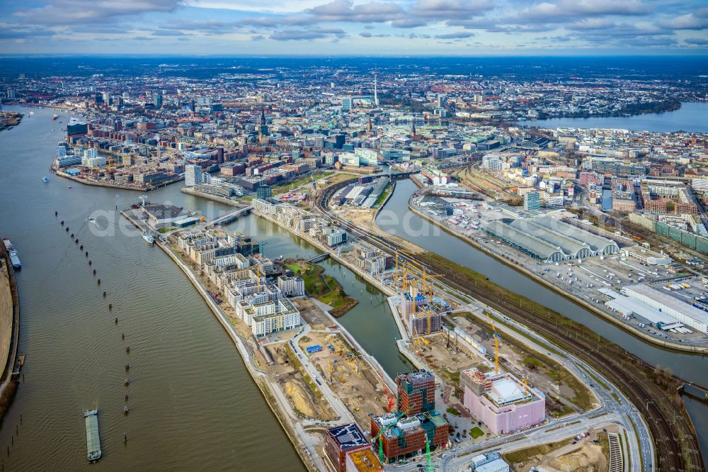 Hamburg from the bird's eye view: Construction sites for residential and commercial buildings in the Baakenhafen along the Baakenallee in HafenCity in Hamburg, Germany