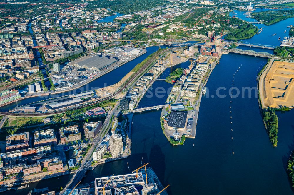 Hamburg from the bird's eye view: Construction sites for residential and commercial buildings in the Baakenhafen along the Baakenallee in HafenCity in Hamburg, Germany