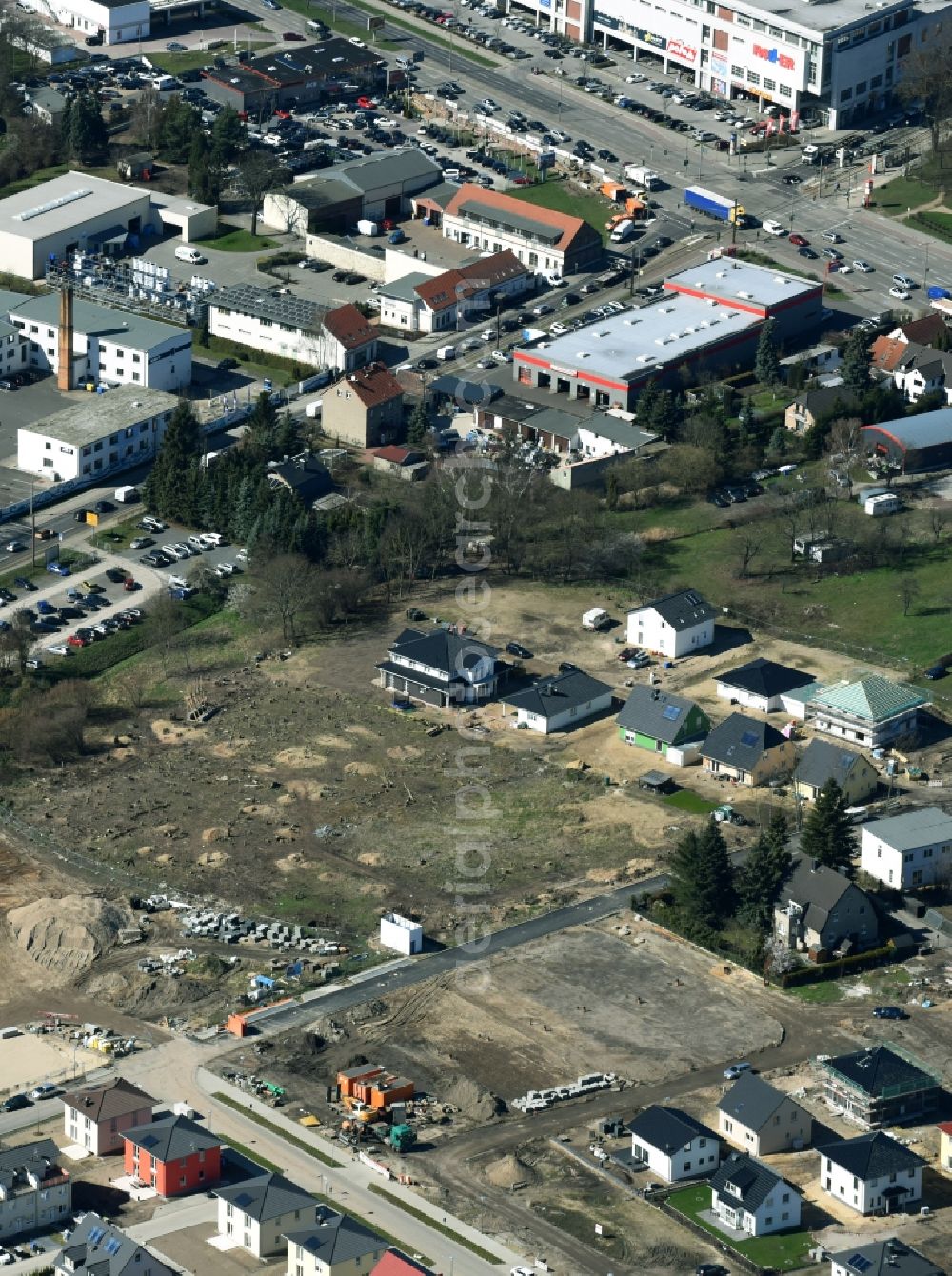 Berlin from the bird's eye view: Construction sites for new construction residential area of detached housing estate of NCC Deutschland GmbH on Hultschiner Damm destrict Mahlsdorf in Berlin in Germany