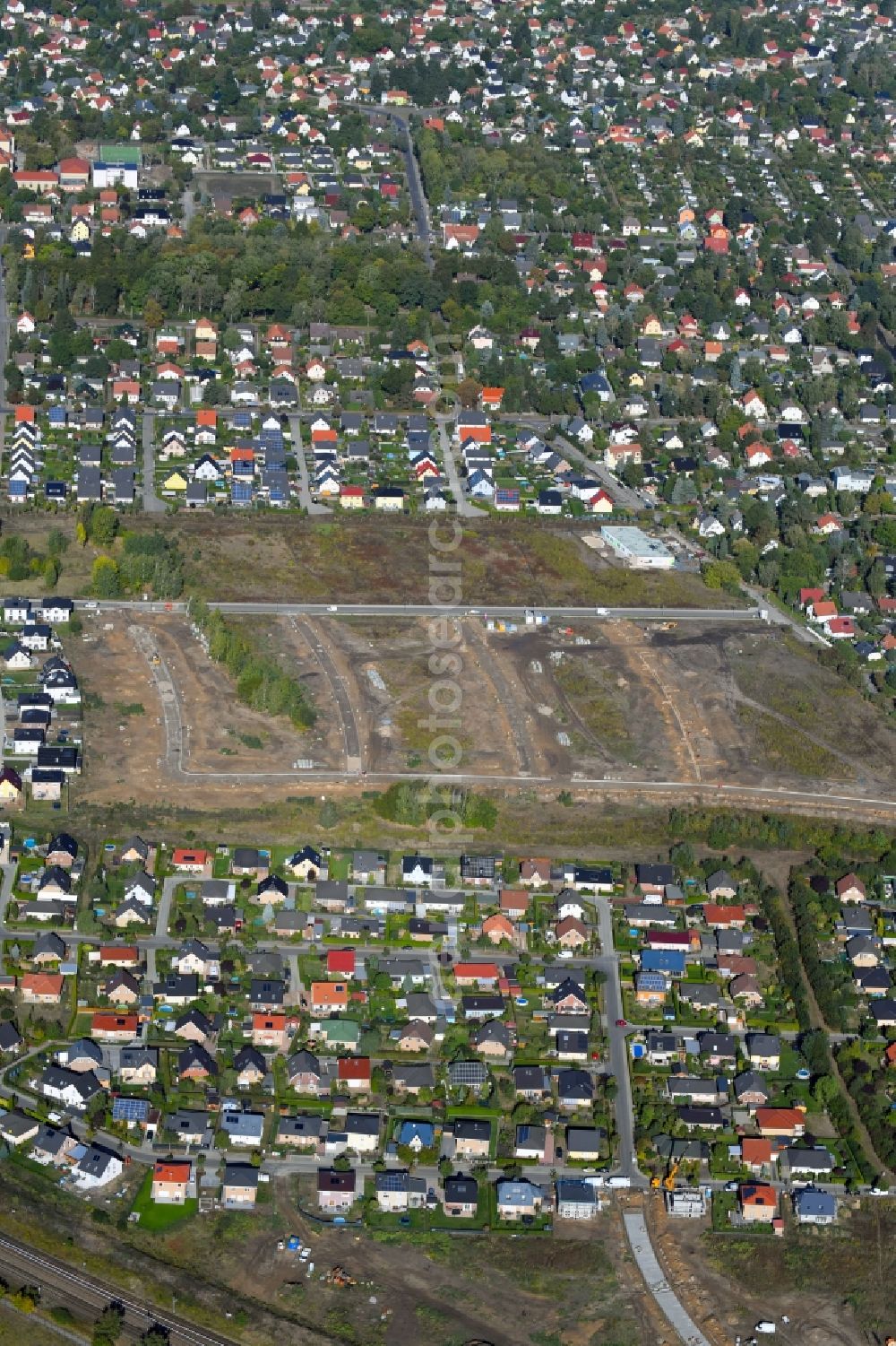 Aerial photograph Berlin - Construction sites for new construction residential area of detached housing estate of degewo AG on Stralsunof Strasse in the district Mahlsdorf in Berlin, Germany