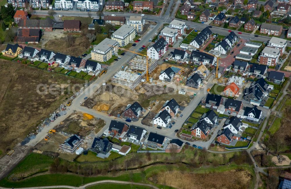 Aerial photograph Kirchhellen - Construction sites for new construction residential area of detached housing estate along the Hackfurthstrasse in Kirchhellen in the state North Rhine-Westphalia, Germany