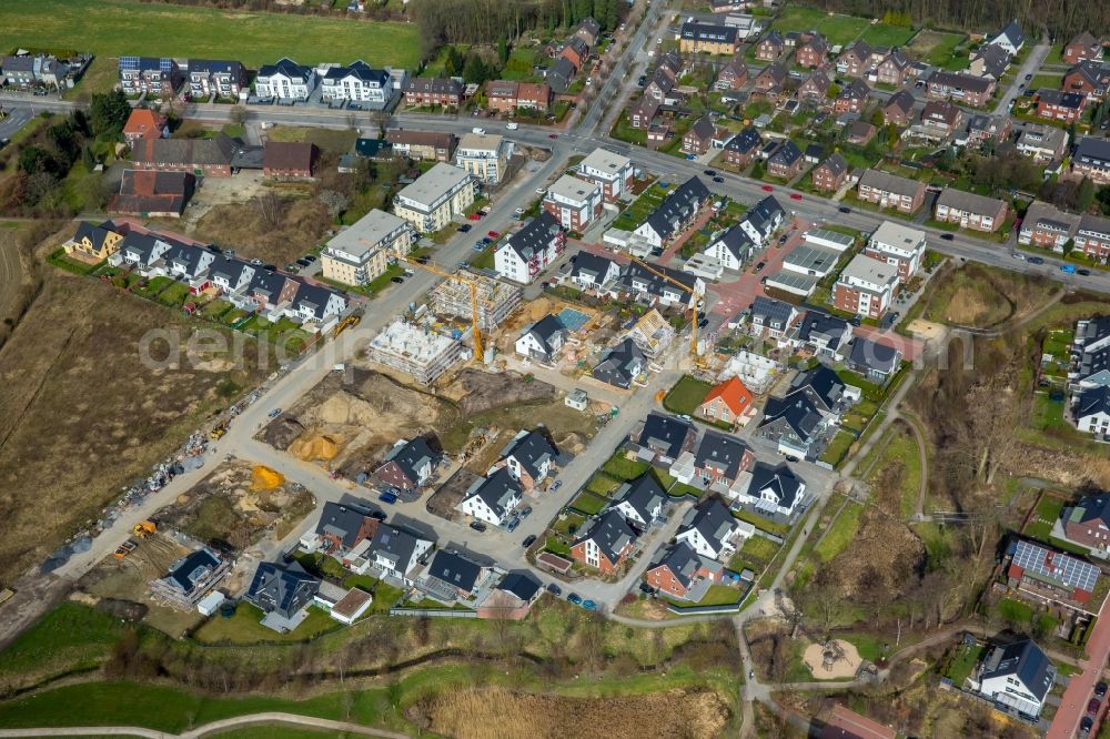 Kirchhellen from above - Construction sites for new construction residential area of detached housing estate along the Hackfurthstrasse in Kirchhellen in the state North Rhine-Westphalia, Germany