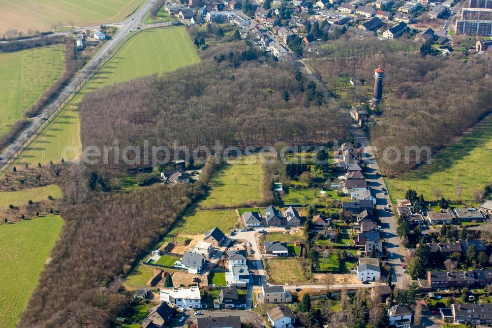 Aerial photograph Moers - Construction sites for a new residential area opposite the old water tower along Vinner Strasse in Moers in the state of North Rhine-Westphalia