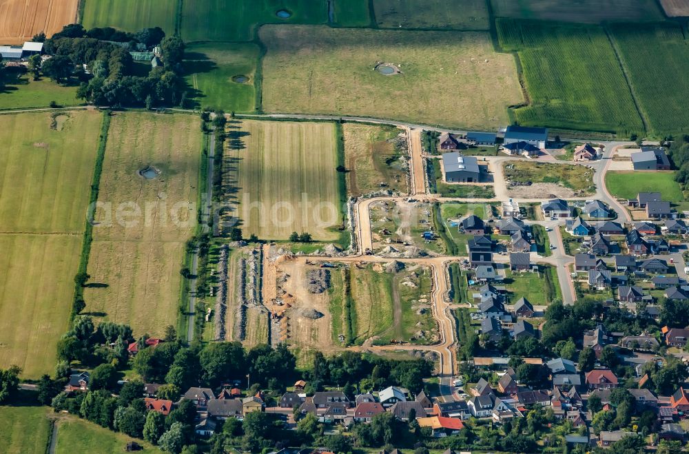 Aerial photograph Oldenswort - Construction sites for new construction residential area of detached housing estate on street Achtert Pastorat in Oldenswort in the state Schleswig-Holstein, Germany