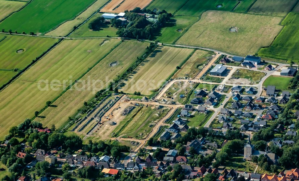 Oldenswort from above - Construction sites for new construction residential area of detached housing estate on street Achtert Pastorat in Oldenswort in the state Schleswig-Holstein, Germany