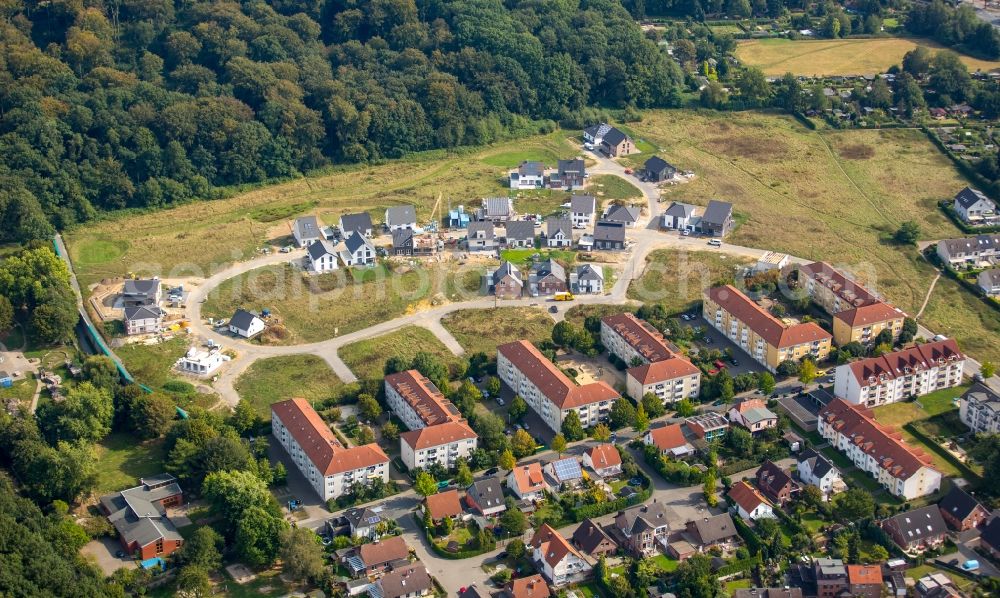 Dortmund from above - Building sites to the new building residential area of a single-family dwelling settlement in the Rahmer wood in Roentgen street in Dortmund in the federal state North Rhine-Westphalia