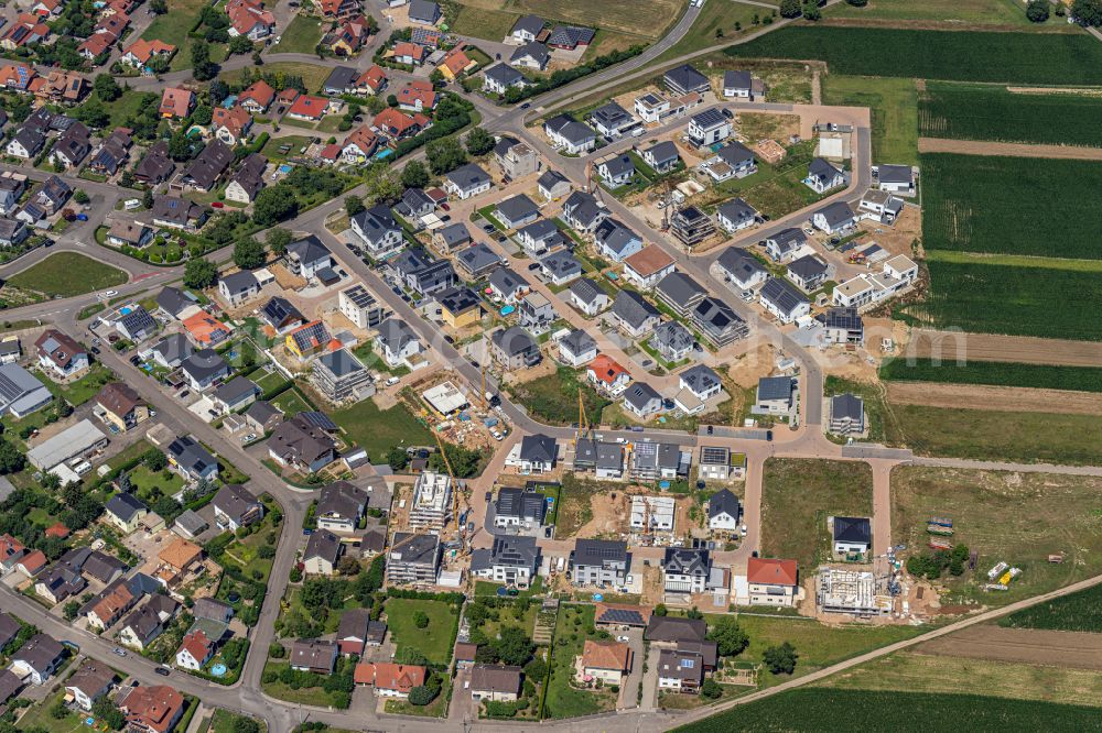 Rheinhausen from the bird's eye view: Construction sites for new construction residential area of detached housing estate on street Keltenweg in Rheinhausen in the state Baden-Wuerttemberg, Germany