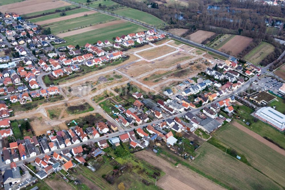 Römerberg from the bird's eye view: Construction sites for new construction residential area of detached housing estate Salierstrasse in the district Heiligenstein in Roemerberg in the state Rhineland-Palatinate, Germany