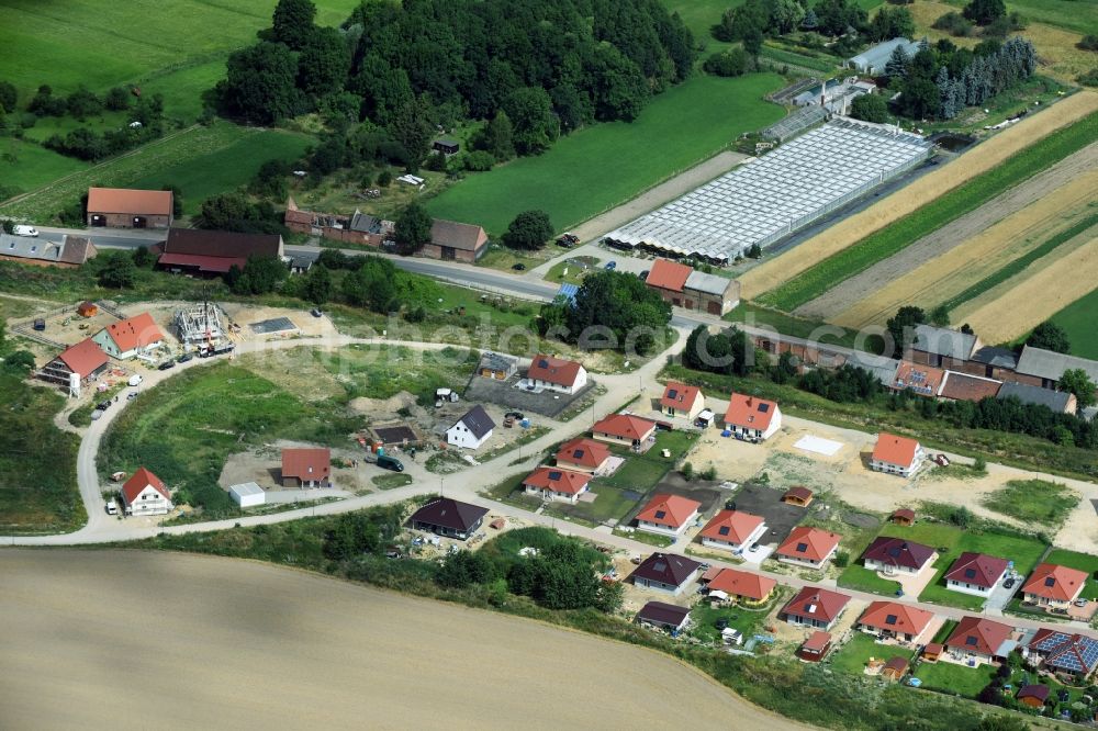 Altlandsberg from the bird's eye view: Construction sites for new construction residential area of detached housing estate on Strausberger Strasse - Zur Holzseefe in Altlandsberg in the state Brandenburg