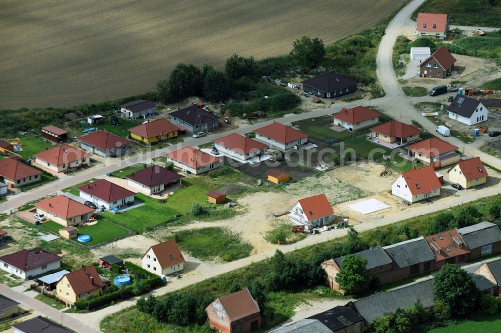 Altlandsberg from the bird's eye view: Construction sites for new construction residential area of detached housing estate on Strausberger Strasse - Zur Holzseefe in Altlandsberg in the state Brandenburg