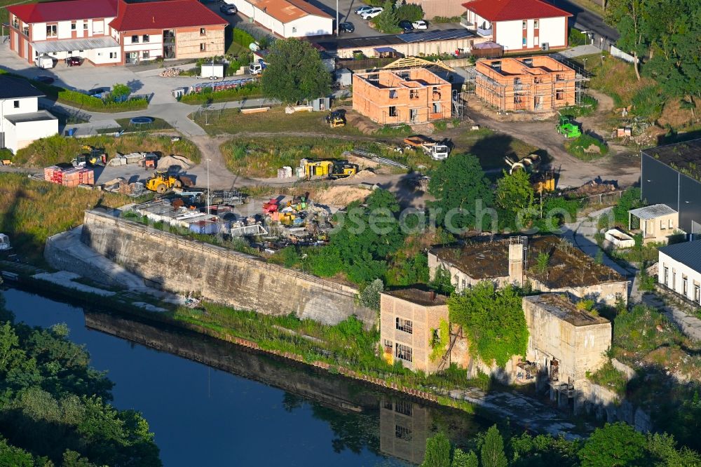 Rüdersdorf from above - Construction sites for new construction residential area of detached housing estate on lake shore of Strausberger Muehlenfliess in Ruedersdorf in the state Brandenburg, Germany