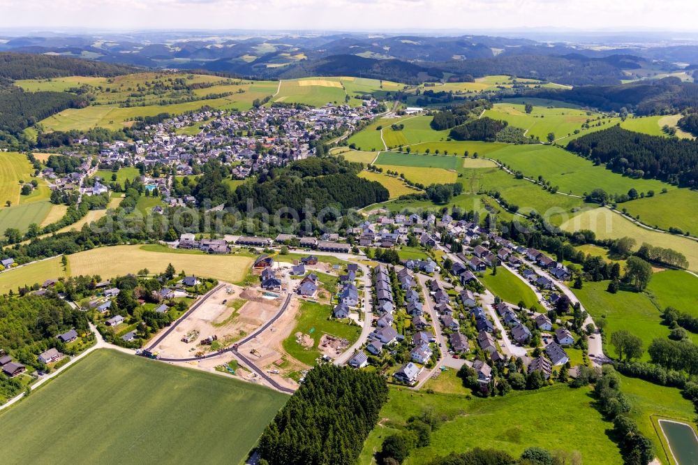 Usseln from the bird's eye view: Construction sites for new construction residential area of detached housing estate Unter of Egge - Am Schneppelnberg in Usseln in the state Hesse, Germany