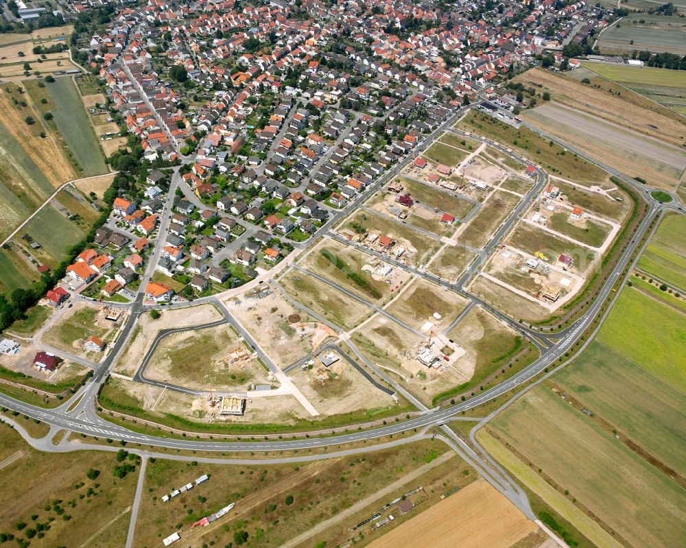 Waghäusel from the bird's eye view: Construction sites for new construction residential area of detached housing estate on street Ostendstrasse in the district Kirrlach in Waghaeusel in the state Baden-Wuerttemberg, Germany