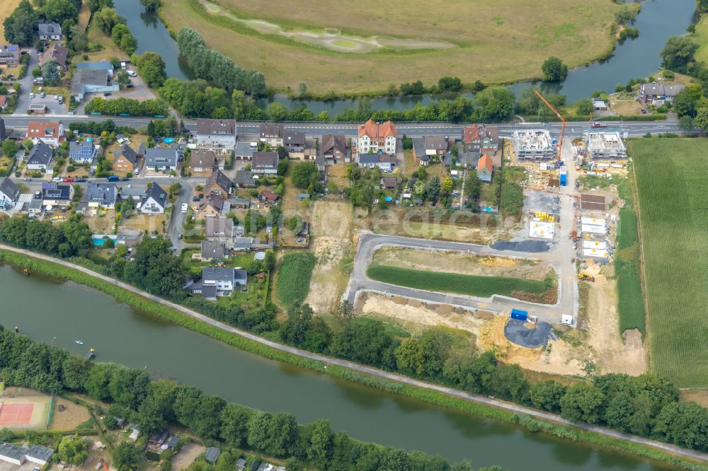 Hamm from the bird's eye view: Construction sites for new construction residential area of detached housing estate Im Fuchswinkel - Lippestrasse in the district Heessen in Hamm at Ruhrgebiet in the state North Rhine-Westphalia, Germany