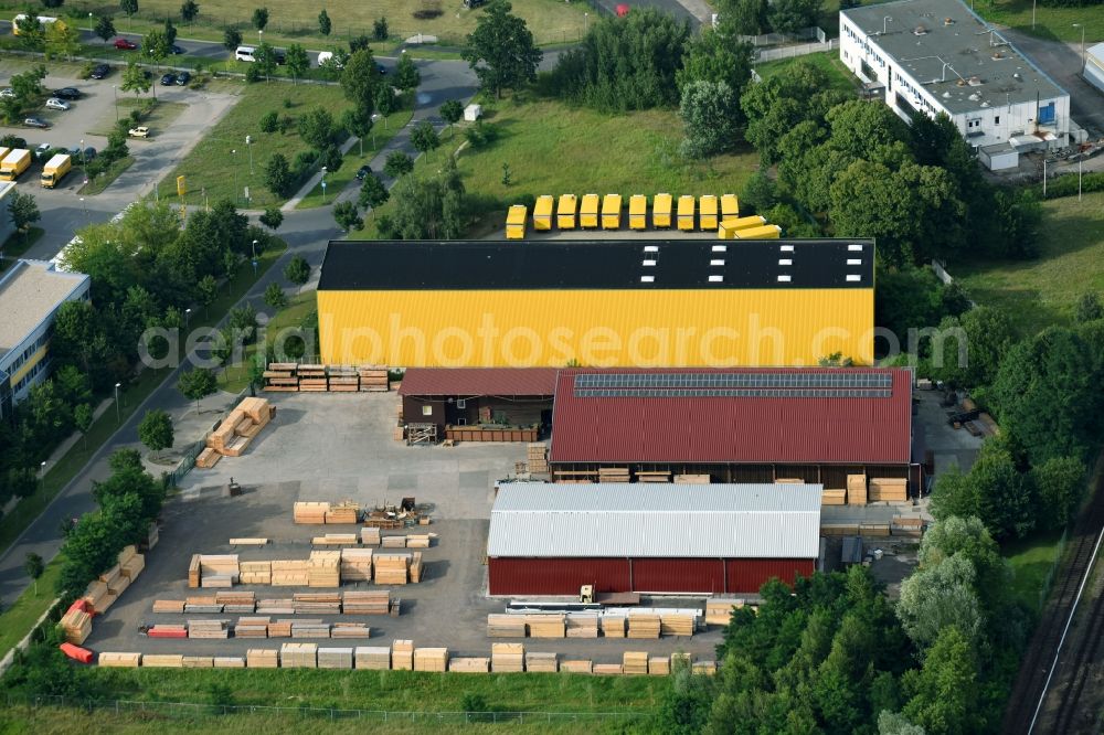 Hennigsdorf from above - Building Materials and logistics center Holz- and Baustoffhandel GmbH Luecke on Walter-Kleinow-Ring in Hennigsdorf in the state Brandenburg, Germany