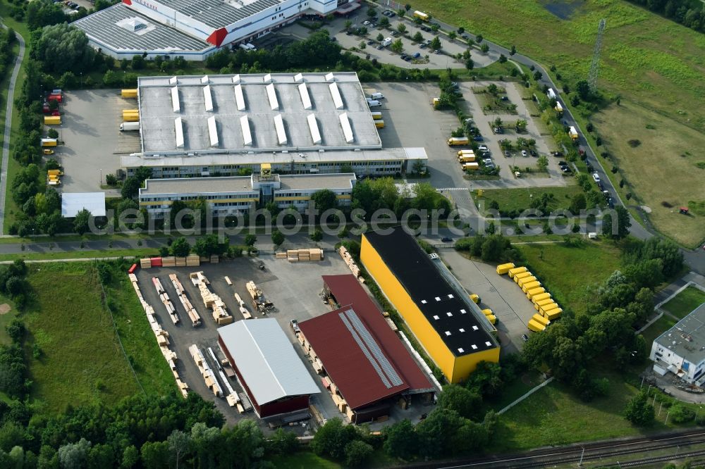 Aerial photograph Hennigsdorf - Building Materials and logistics center Holz- and Baustoffhandel GmbH Luecke on Walter-Kleinow-Ring in Hennigsdorf in the state Brandenburg, Germany