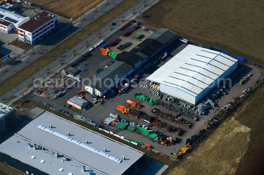 Berlin from the bird's eye view: Building Materials and logistics center of Muffenrohr Tiefbauhandel GmbH on Gross-Berliner Donm in the district Adlershof - Johannestal in Berlin, Germany