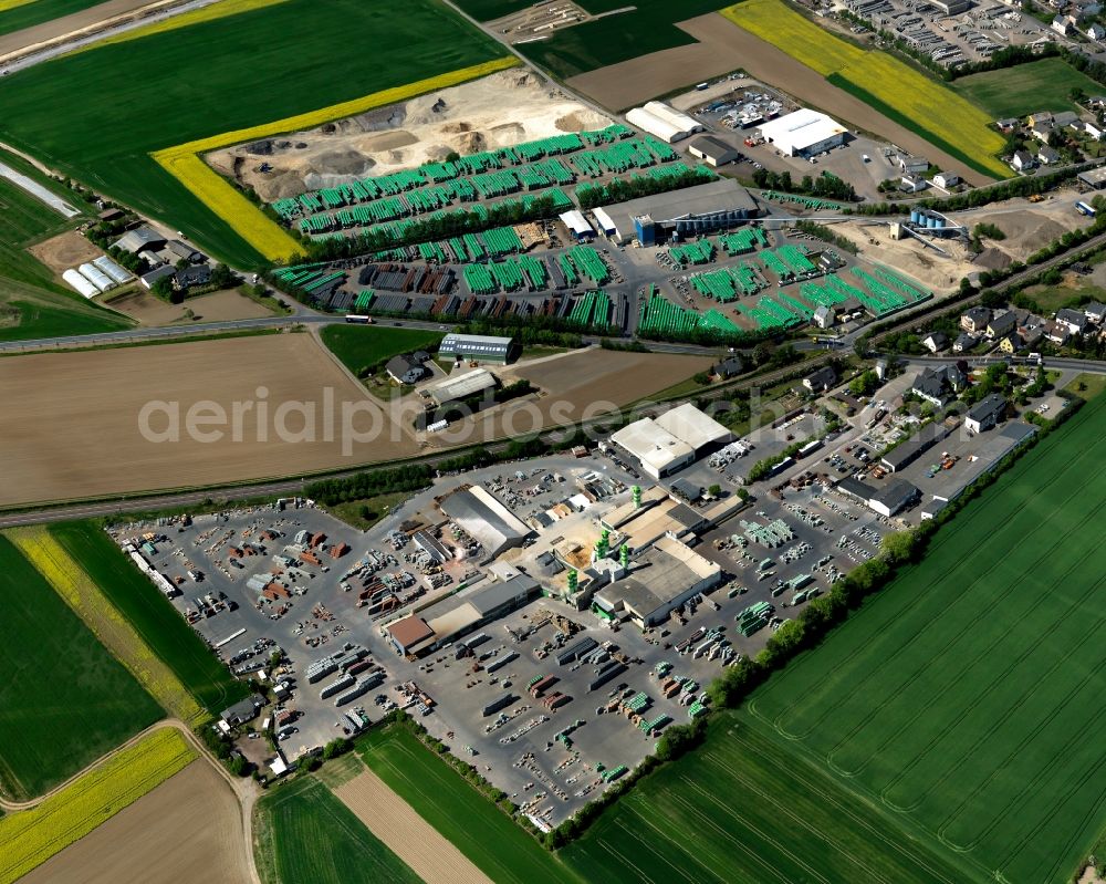 Aerial image Kruft - Building material works in Kruft in the state of Rhineland-Palatinate. The agricultural borough and municipiality is located in the county district of Mayen-Koblenz and surrounded by meadows and rapeseed fields. In the west of the borough, the works and shops of Quick-Mix-Group and EHL AG are located