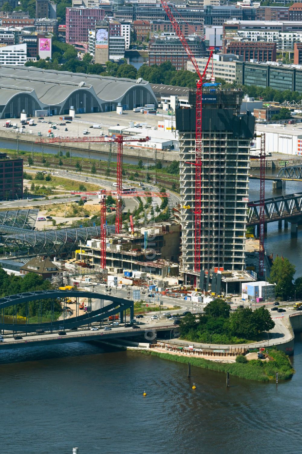 Hamburg from above - Construction stop on the construction site for the new high-rise building complex Elbtower on Zweibrueckenstrasse between Oberhafenkanal and Norderelbe in the HafenCity district of Hamburg, Germany