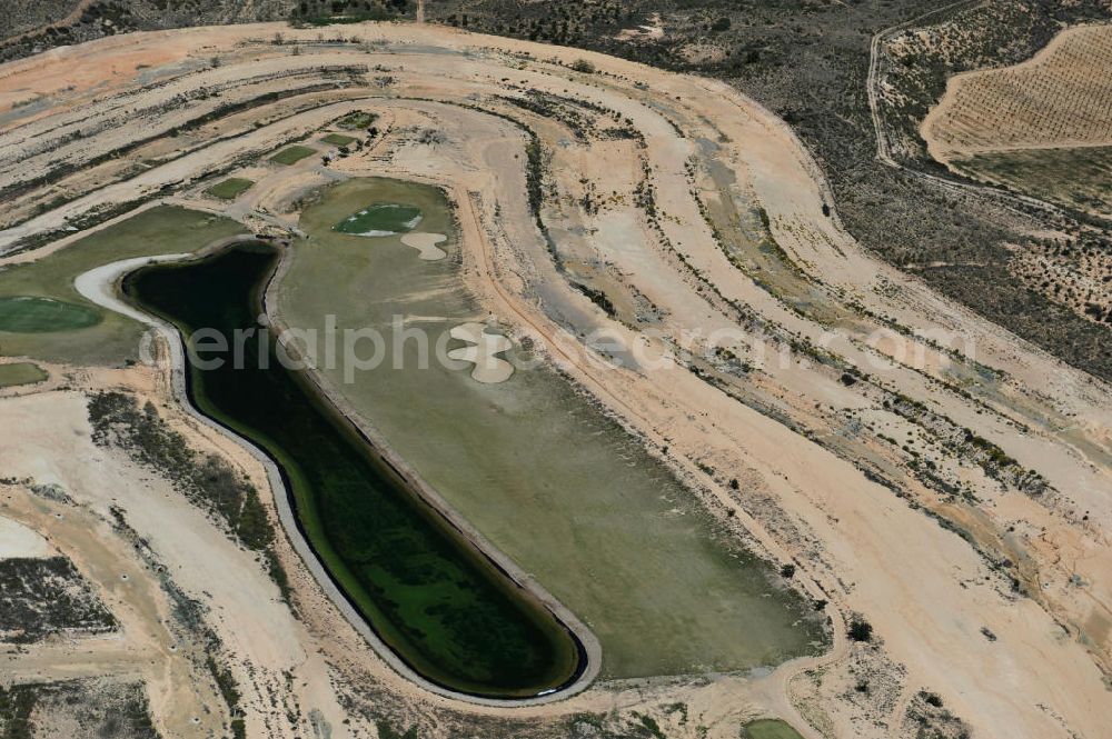 Aerial photograph Casa Pelada - Freeze on developed land for holiday homes in Casa Pelada in the region of Murcia in Spain. The real estate and financial crisis has left their marks in the region