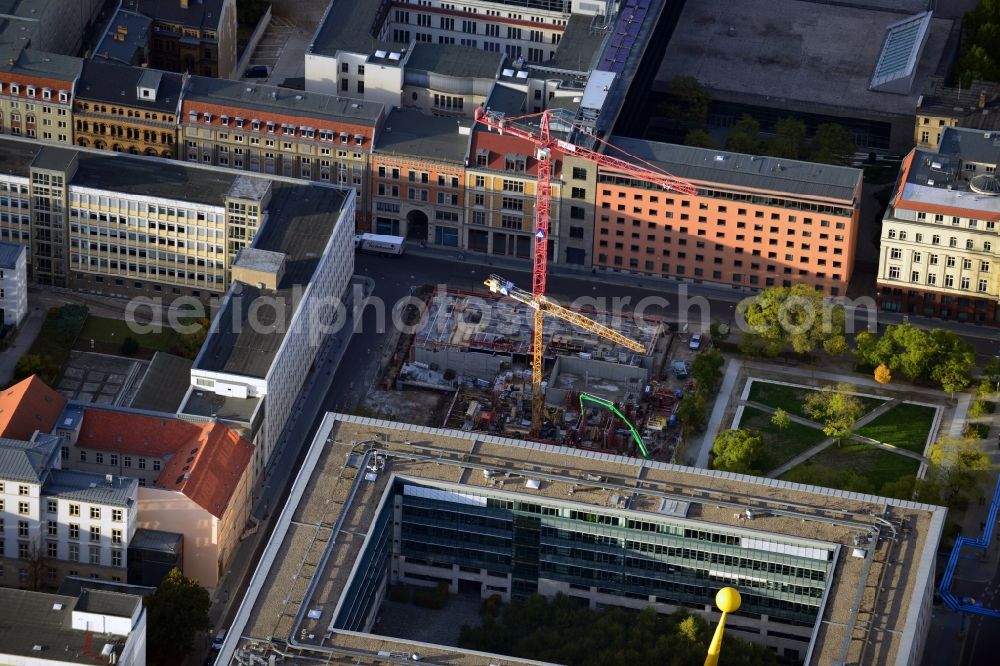 Aerial image Berlin - View of the construction site of the residential complex Lux at Neustaedtischer Kirchplatz in Berlin - Mitte. Developing companies of the building complex with its modern luxurious apartments and commercial space are Ziegert banking and real estate consulting GmbH and HOCHTIEF AG. The plans for the building were designed the architectural firm Axthelm Rolvien GmbH & Co. KG