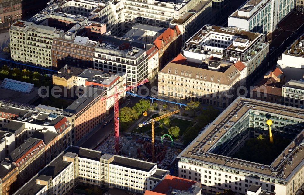 Berlin from the bird's eye view: View of the construction site of the residential complex Lux at Neustaedtischer Kirchplatz in Berlin - Mitte. Developing companies of the building complex with its modern luxurious apartments and commercial space are Ziegert banking and real estate consulting GmbH and HOCHTIEF AG. The plans for the building were designed the architectural firm Axthelm Rolvien GmbH & Co. KG