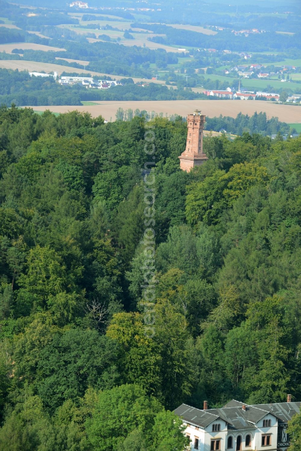 Aerial image Rochlitz - Structure of the observation tower Friedrich-August-Tower on Rochlitzer Mountain in Rochlitz in the state of Saxony. The historic tower from 1860 is located in a forest next to the restaurant Tuermerhaus