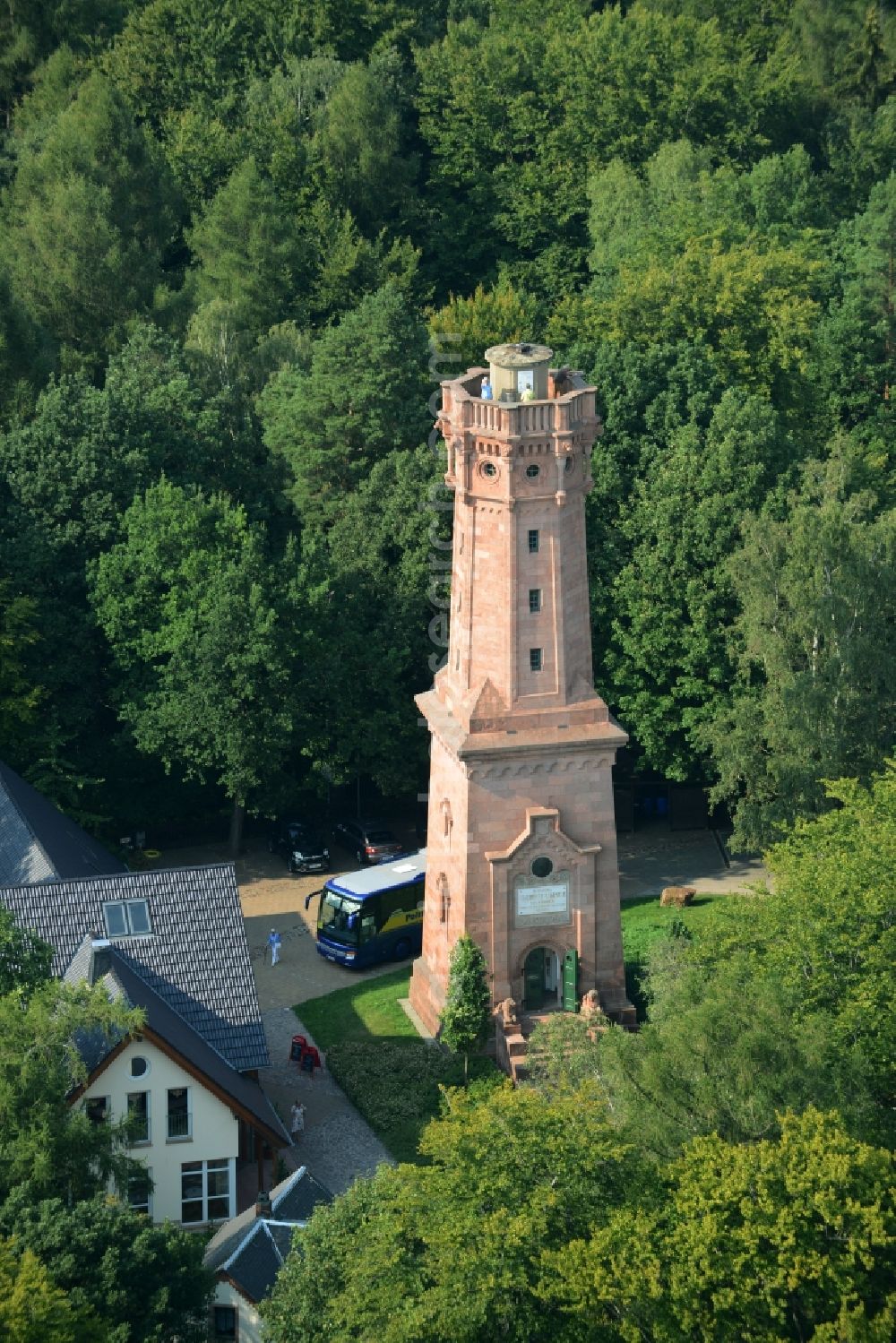 Rochlitz from above - Structure of the observation tower Friedrich-August-Tower on Rochlitzer Mountain in Rochlitz in the state of Saxony. The historic tower from 1860 is located in a forest next to the restaurant Tuermerhaus