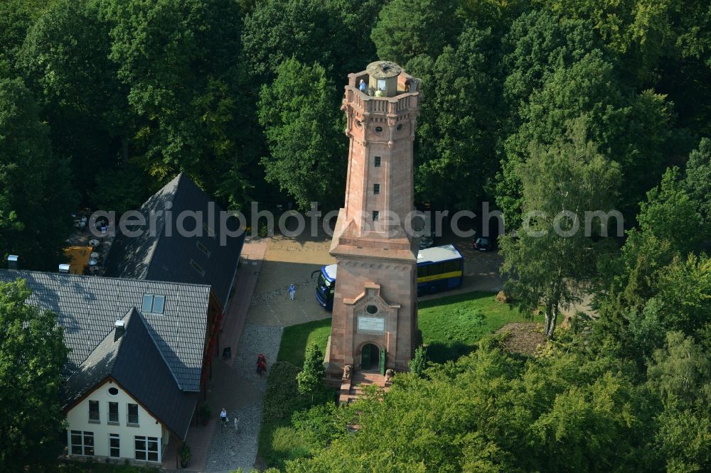 Rochlitz from the bird's eye view: Structure of the observation tower Friedrich-August-Tower on Rochlitzer Mountain in Rochlitz in the state of Saxony. The historic tower from 1860 is located in a forest next to the restaurant Tuermerhaus