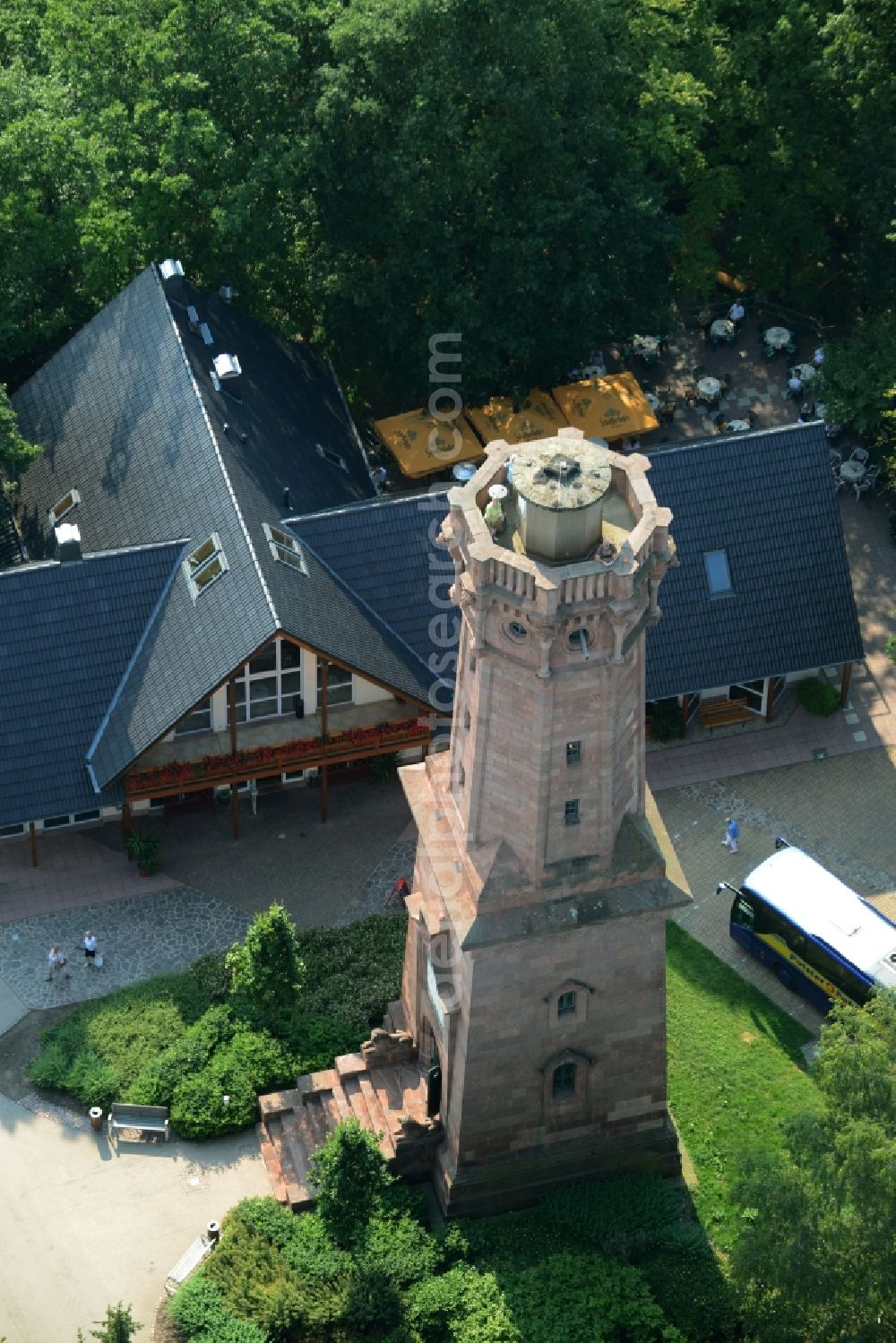 Aerial image Rochlitz - Structure of the observation tower Friedrich-August-Tower on Rochlitzer Mountain in Rochlitz in the state of Saxony. The historic tower from 1860 is located in a forest next to the restaurant Tuermerhaus