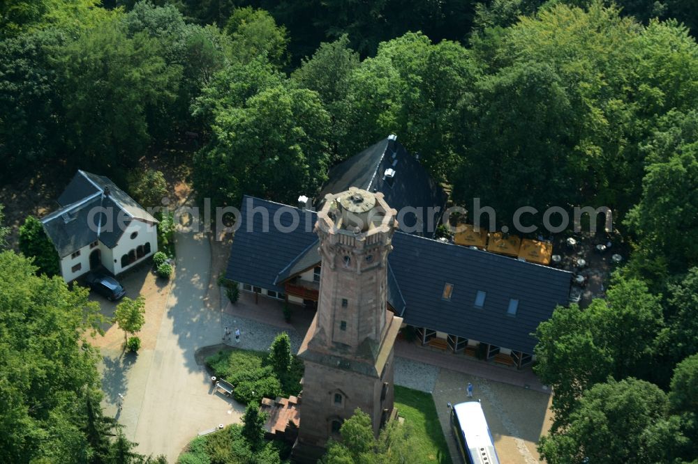 Rochlitz from above - Structure of the observation tower Friedrich-August-Tower on Rochlitzer Mountain in Rochlitz in the state of Saxony. The historic tower from 1860 is located in a forest next to the restaurant Tuermerhaus