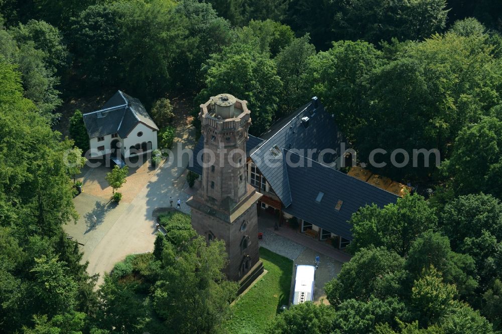 Rochlitz from the bird's eye view: Structure of the observation tower Friedrich-August-Tower on Rochlitzer Mountain in Rochlitz in the state of Saxony. The historic tower from 1860 is located in a forest next to the restaurant Tuermerhaus