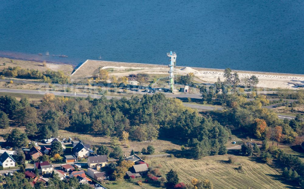 Merzdorf from above - Construction of the observation tower at the flooded open-cast mining landscape Ostsee Baltic Sea on Merzdorfer Hauptstrasse in Merzdorf in the state of Brandenburg, Germany