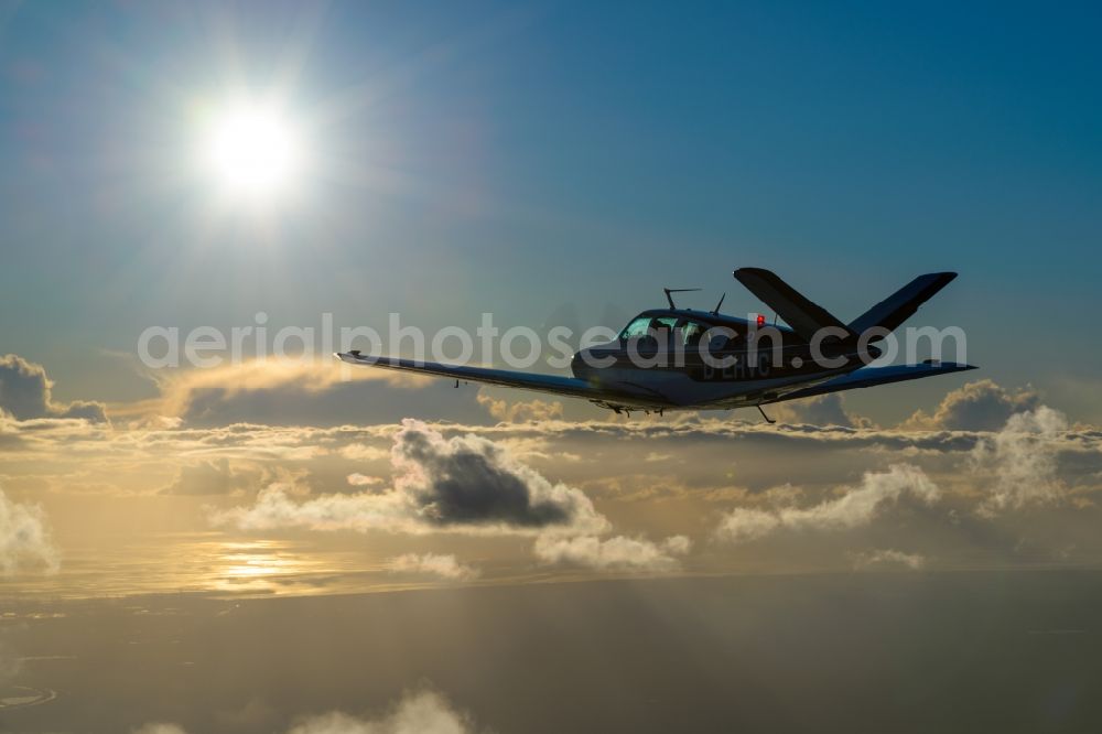 Aerial photograph Bremerhaven - Beechcraft Bonanza D-EHVC in flight over the Weser-estuary in the North Sea near Bremerhaven in the state of Bremen, Germany. The Beechcraft Model 36 Bonanza is produced by Beech Aircraft Corporation as a travel and business aircraft