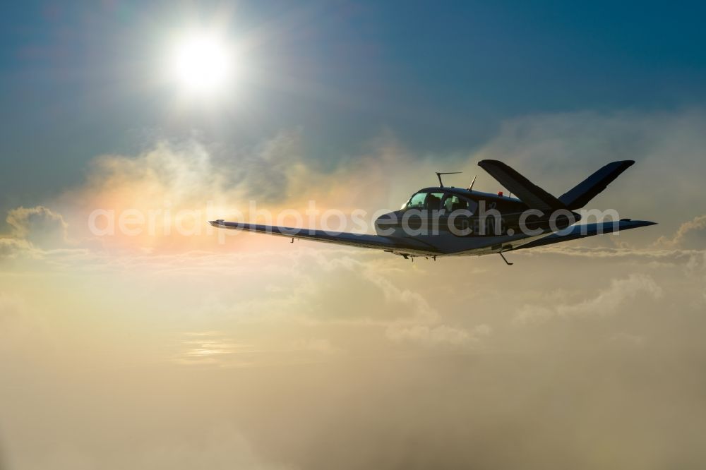 Bremerhaven from above - Beechcraft Bonanza D-EHVC in flight near Bremerhaven in the state of Bremen, Germany. The Beechcraft Bonanza is produced by Beech Aircraft Corporation as a travel and business aircraft