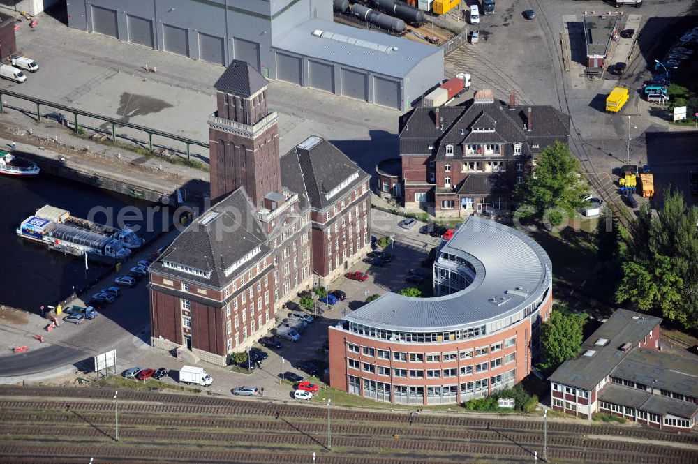 Aerial photograph Berlin - Blick auf das BEHALA-Verwaltungsgebäude mit dem 52 Meter hohen Turm im Berliner Westhafen in Berlin-Mitte. Die Firma BEHALA entwickelt innovative und umweltgerechte Logistiklösungen. View to the administrative building of the company BEHALA in Berlin-Mitte. The BELAHA company developes innovative and environmentally compliant logistics solutions.