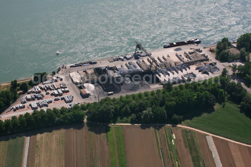 Weil am Rhein from above - Loading zone for sand and bulk material in the harbour at the river Rhine in Weil am Rhein in the state Baden-Wurttemberg, Germany