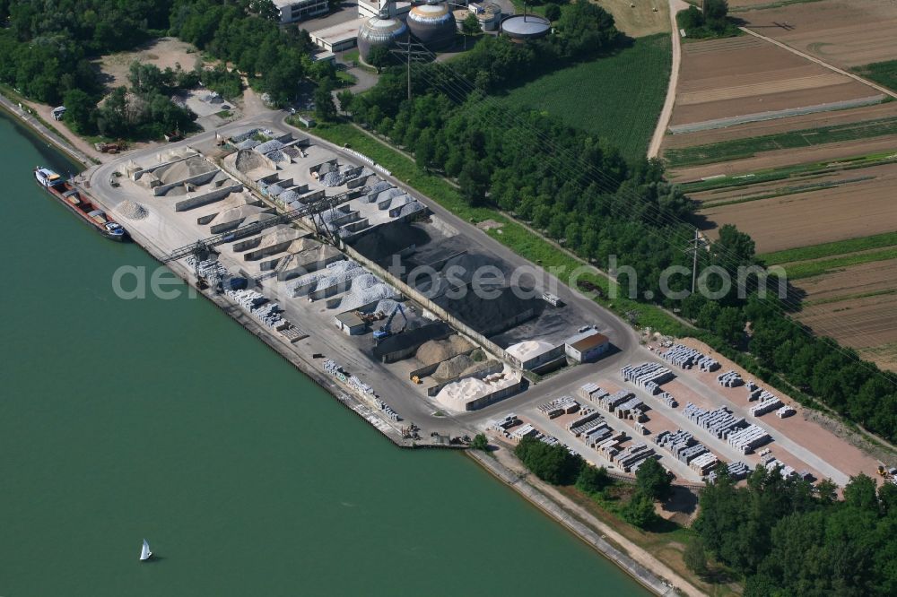 Weil am Rhein from the bird's eye view: Loading zone for sand and bulk material in the harbour at the river Rhine in Weil am Rhein in the state Baden-Wurttemberg, Germany