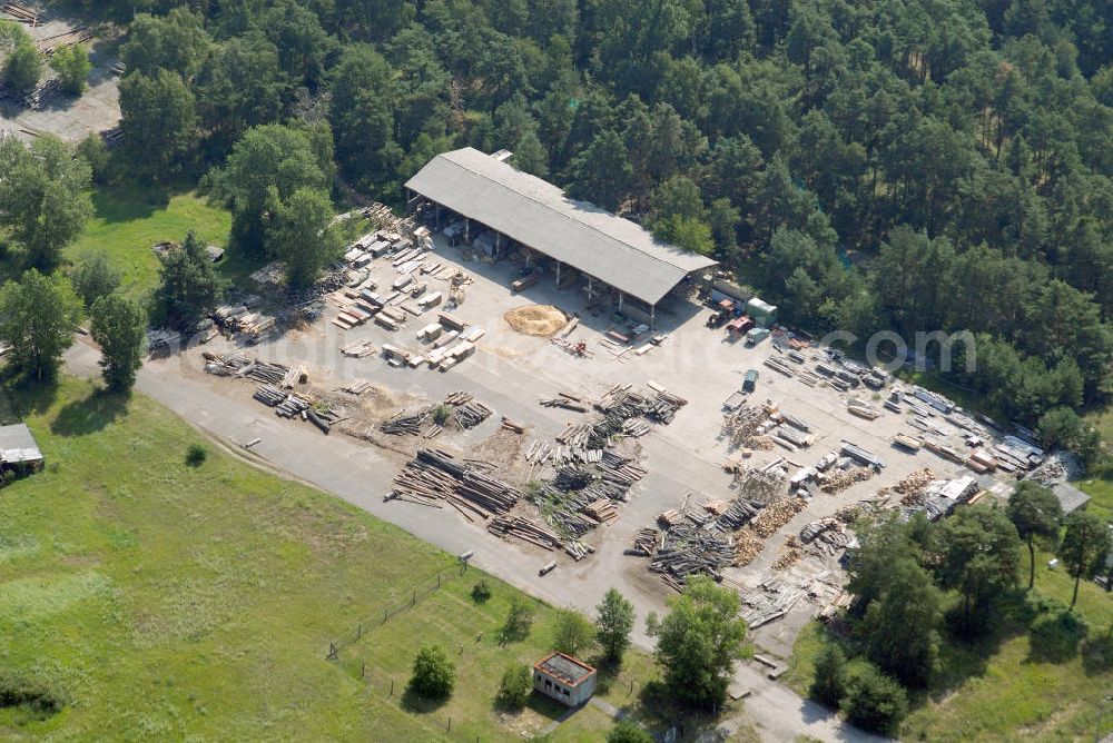 BRANDENBURG BRIEST from the bird's eye view: Blick auf als Gewerbeflächen genutzte Bereiche des alten NVA / Bundeswehr - Flugplatz Briest. Die Grundstückseigentümerin Bundesanstalt für Immobilienaufgaben (Bima) will hier einen Solarenergie-Produzenten ansiedeln. View of commercial space used as parts of the old army / armed forces - the airport Briest.