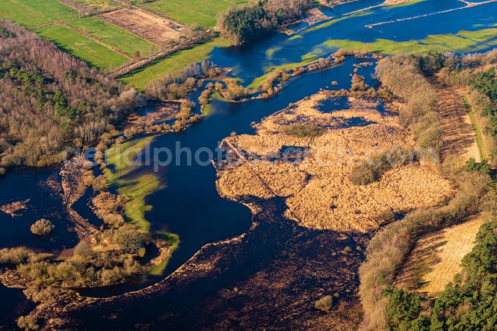 Sandbostel from above - Riparian areas and flooded flood meadows due to a river bed leading to flood levels Oste in Sandbostel in the state Lower Saxony, Germany