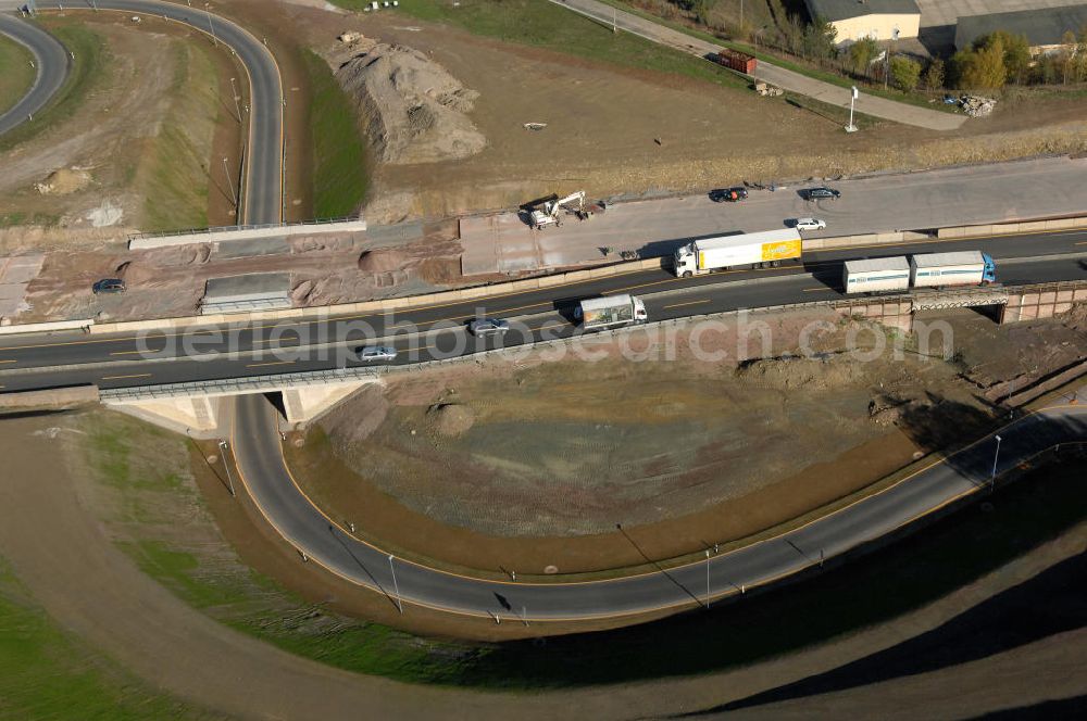 Aerial image Eisenach - Blick auf die Baustelle des Übergang der alten A4 auf die neue A4 nahe der neuen Anschlussstelle Eisenach-West. Der Neubau ist Teil des Projekt Nordverlegung / Umfahrung Hörselberge der Autobahn E40 / A4 in Thüringen bei Eisenach. Durchgeführt werden die im Zuge dieses Projektes notwendigen Arbeiten unter an derem von den Mitarbeitern der Niederlassung Weimar der EUROVIA Verkehrsbau Union sowie der Niederlassungen Abbruch und Erdbau, Betonstraßenbau, Ingenieurbau und TECO Schallschutz der EUROVIA Beton sowie der DEGES.