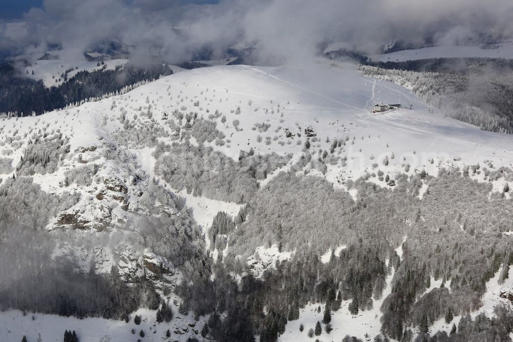 Aerial image Schönenberg - Snow-covered peak of Belchen in the Black Forest in Schoenau in the state of Baden- Wuerttemberg . The Belchen house can only be reached on foot or by the Belchen cableway