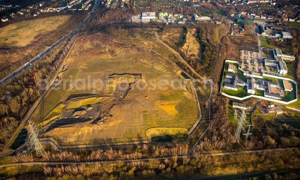 Herne from the bird's eye view: The slag heap Pluto-Wilhelm at the motorway A 42 in the coal mining area in the district Herne Wanne-Eickel in North Rhine-Westphalia