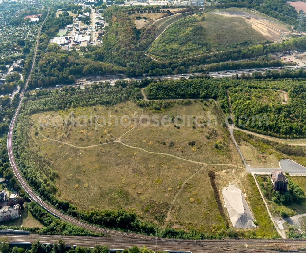 Herne from the bird's eye view: The slag heap Pluto-Wilhelm at the motorway A 42 in the coal mining area in the district Herne Wanne-Eickel in North Rhine-Westphalia