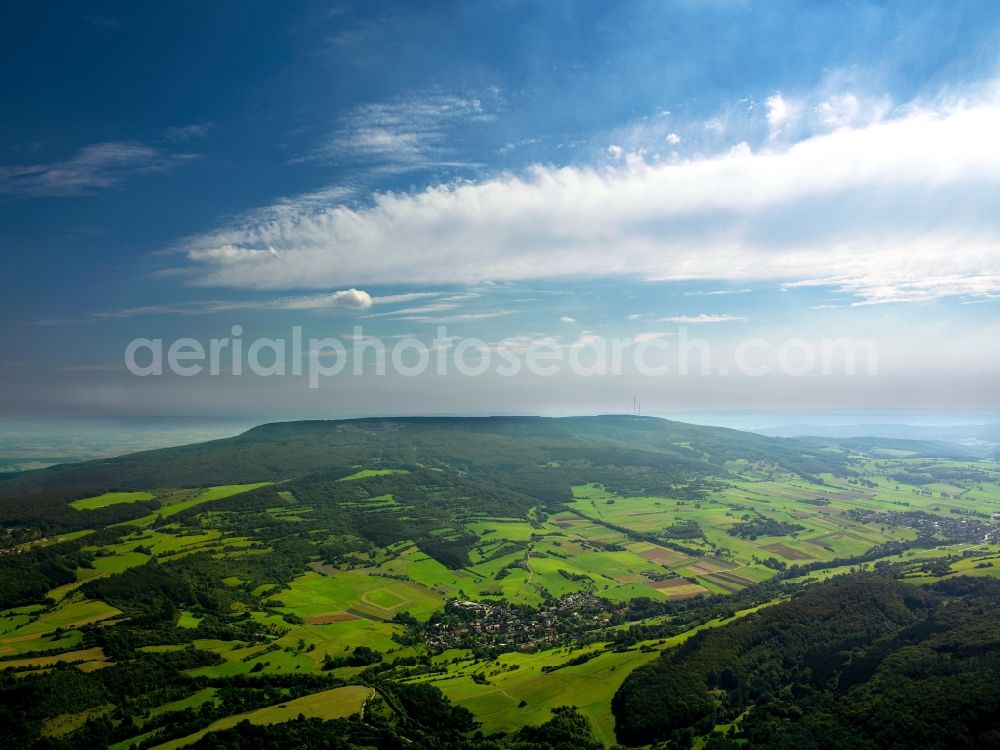 Meißner from the bird's eye view: Mountain massif Hoher Meissner in the borough of Meissner in the state of Hesse. The mountain range is located in the Nature Park Meissner-Kaufunger Forest. It is located between agricultural area, villages and small hamlets and is largely covered with forest. A plateau sits on top of the mountain and its highest point, the Kasseler Kuppe